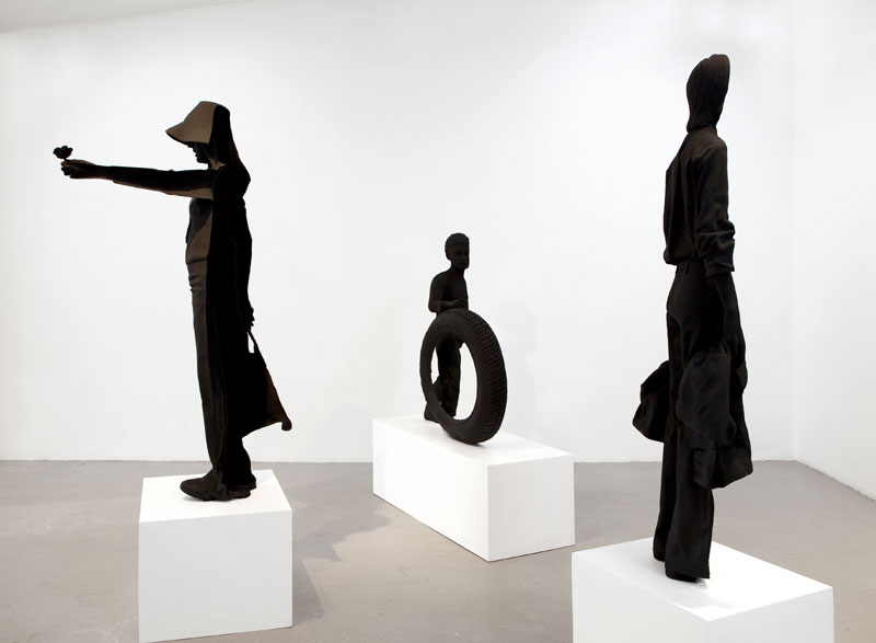 The Young Women Facing the Military Police, resin cast, 2009 and The Little Boy on Independance Day, resin cast, 2009 and The Man Who Stops a Column of Tanks, resin cast, 2008